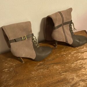 High heal boots that are size it says 9B brand feather upper. Light brown,dark